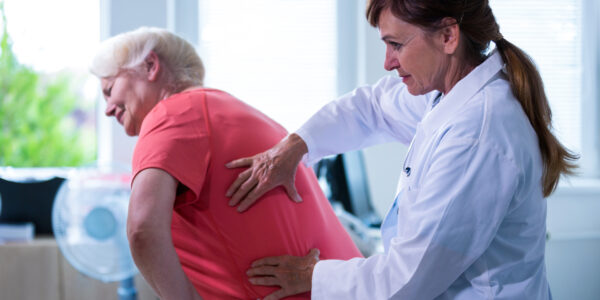 Female doctor examining a patient at the hospital